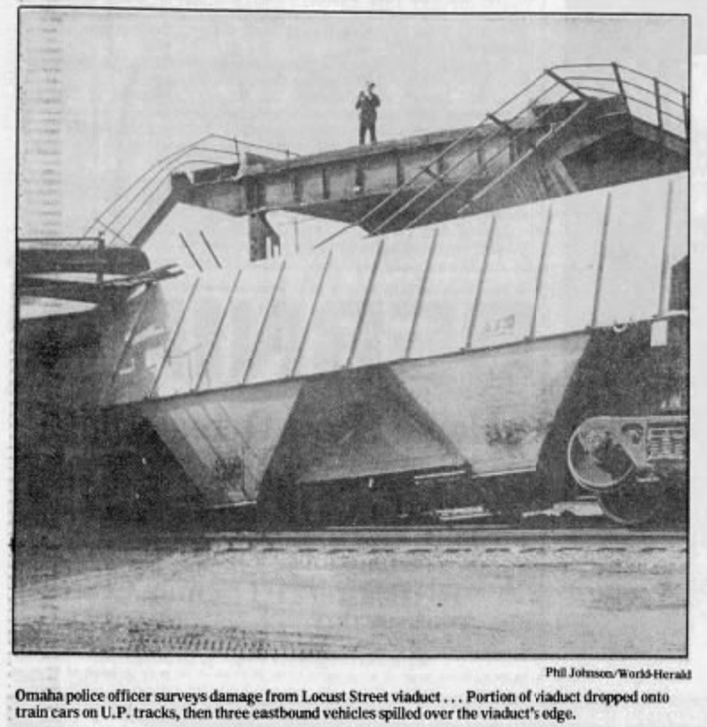 This picture shows a policeman standing on the Locust Street Viaduct, which was wrecked by runaway railroad cars that crashed into it in March 1990. It was demolished soon afterward.
